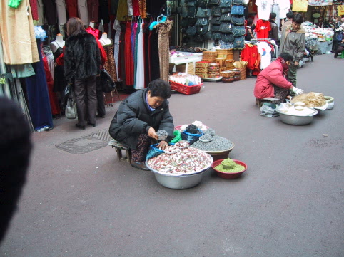 Woman selling beans